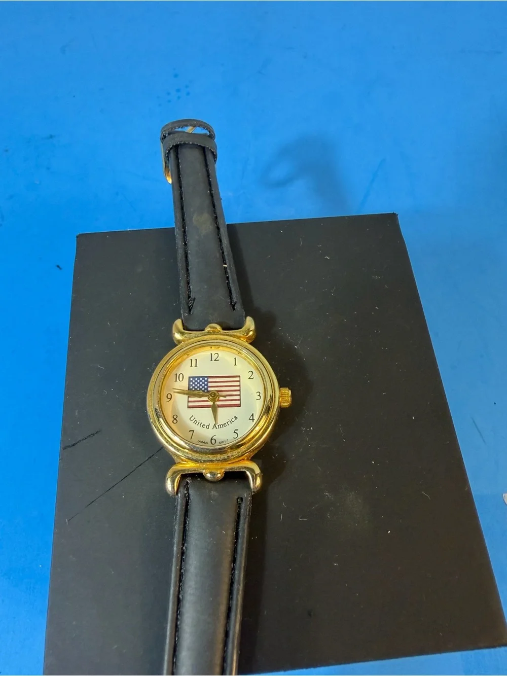 Gold Dial Black Leather Strap Women's Watch with American Flag Accent